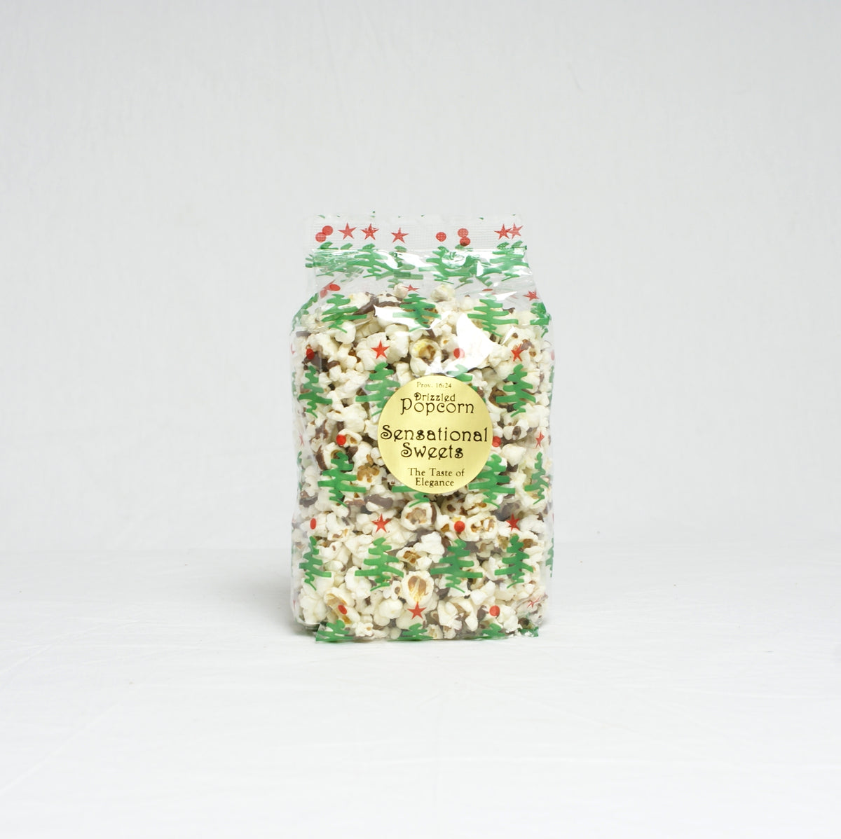 Packaged popcorn with festive design on a light gray background